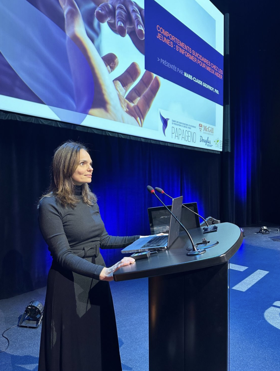 Woman at podium giving lecture at conference