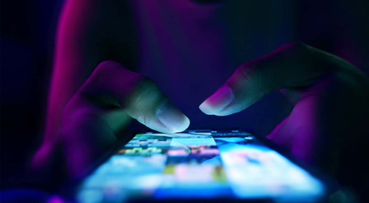 Close up of phone screen as woman scrolls